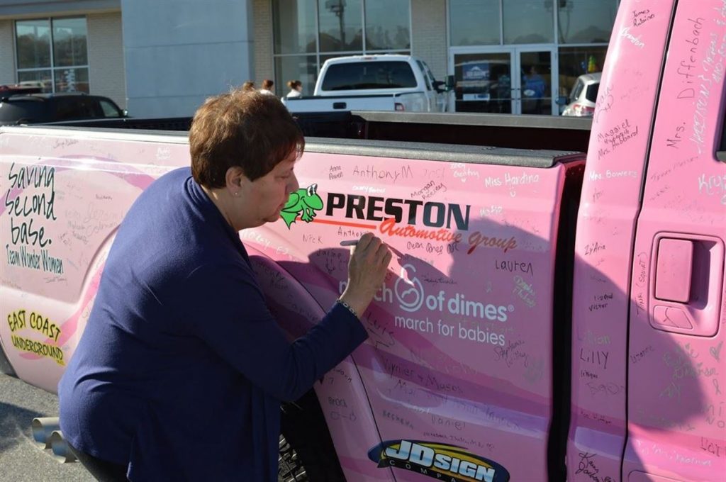 Signing pink truck